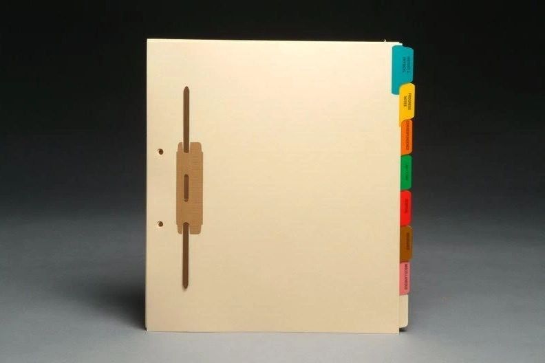 A binder with dividers and a wooden handle.
