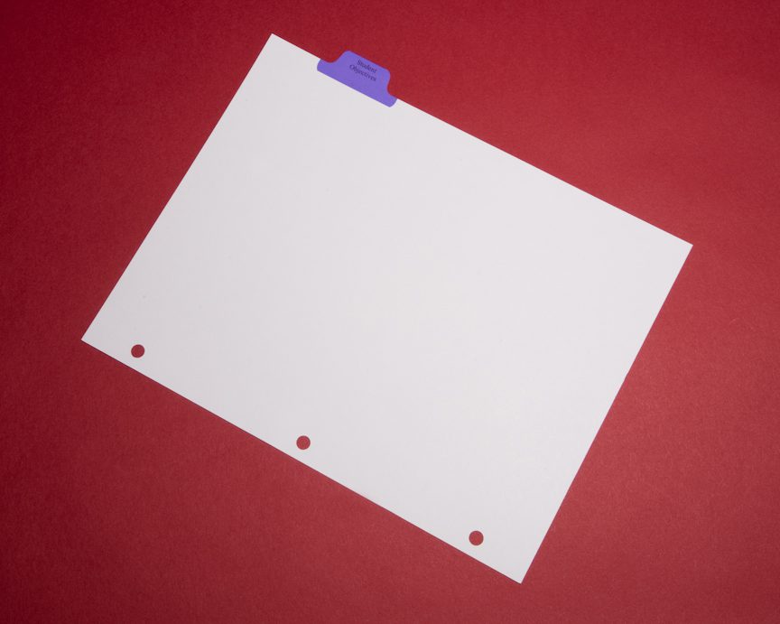 A piece of paper with three holes on it.