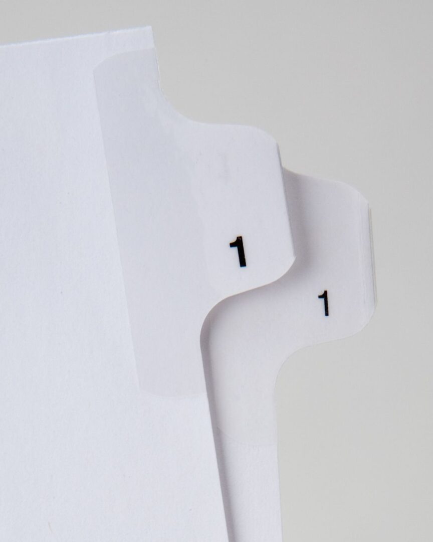 A close up of the number 1 on top of two white dividers.