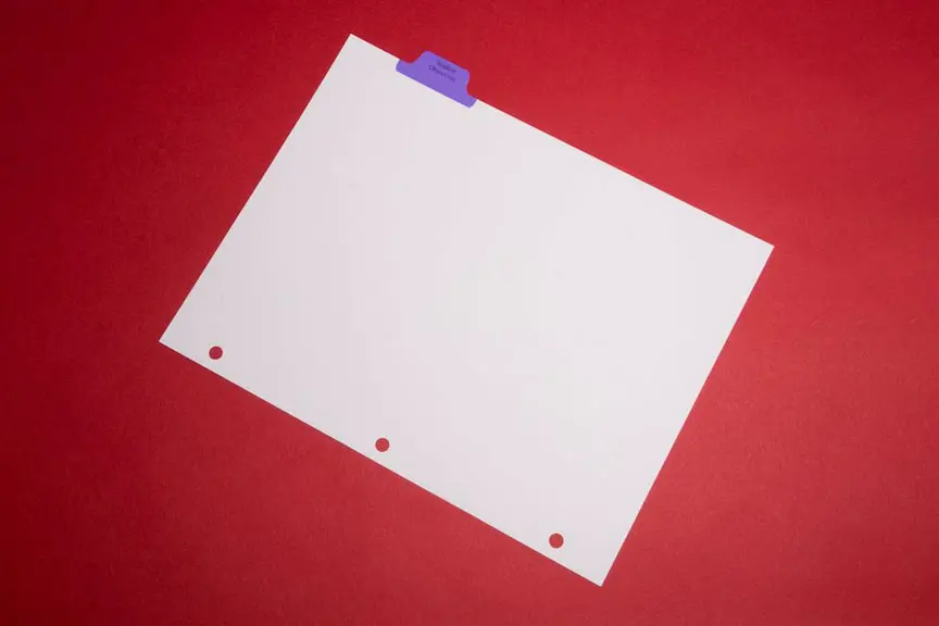 A piece of paper with three holes on it.